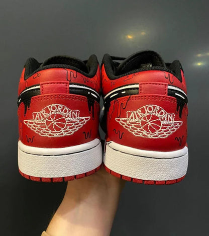 Jordan 1 low goteo rojo